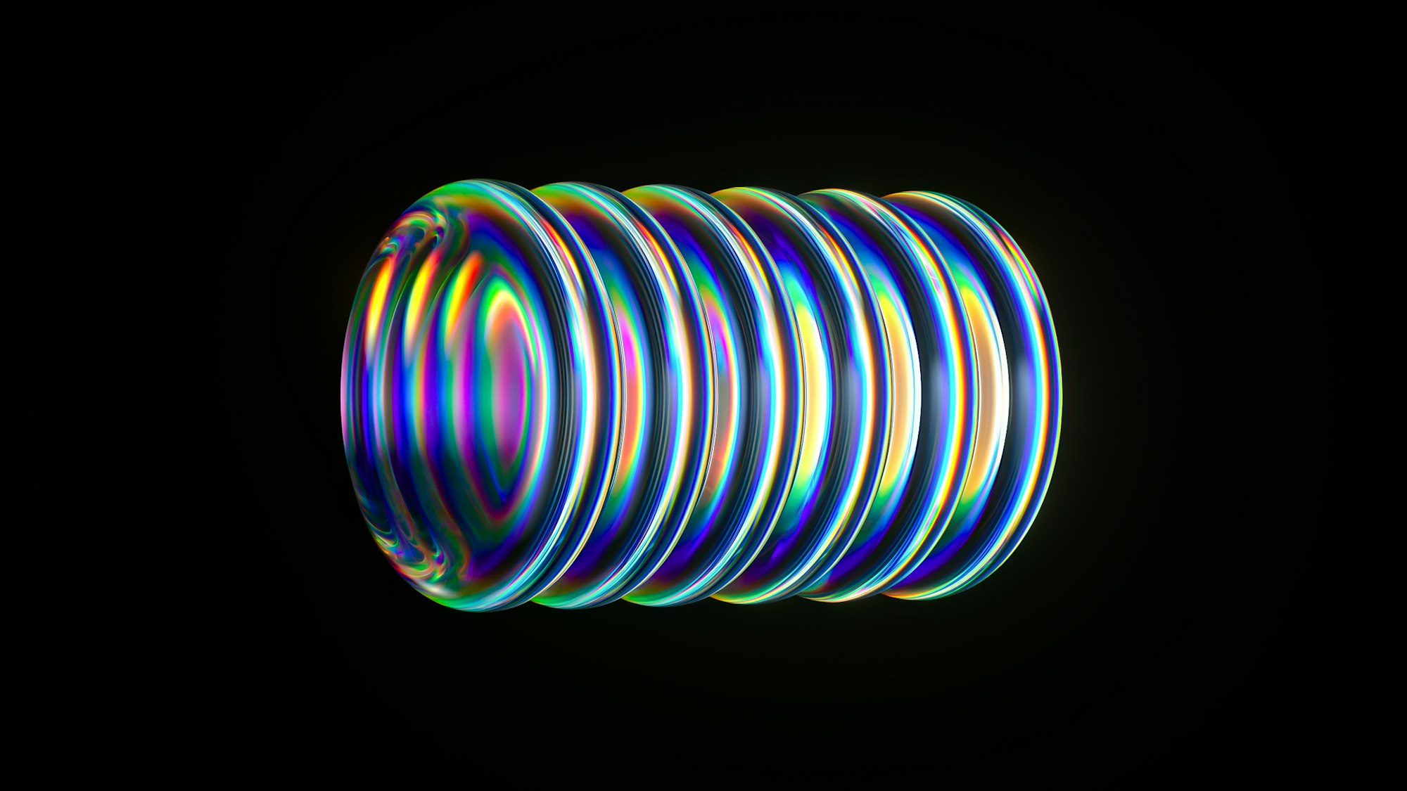 A bright, colorful coil glows against black.
